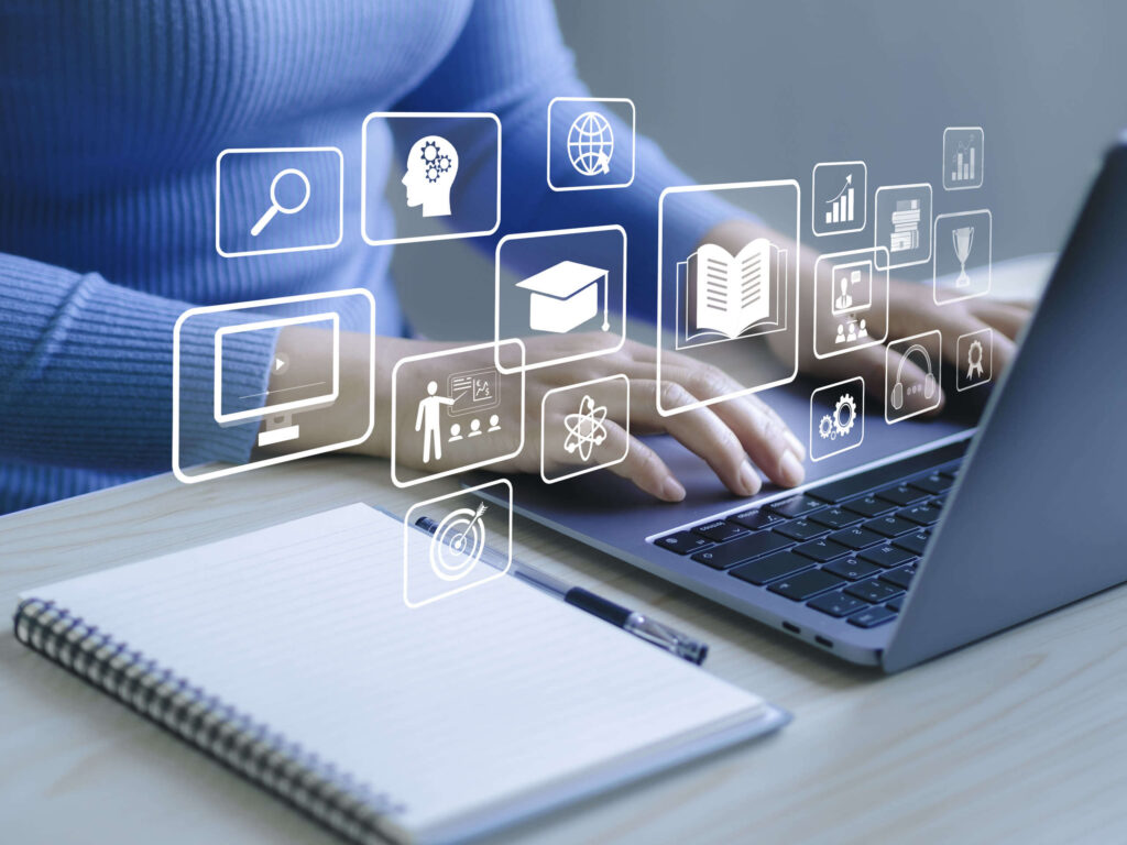 Online learning with a laptop and e-learning icons